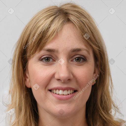 Joyful white young-adult female with long  brown hair and green eyes