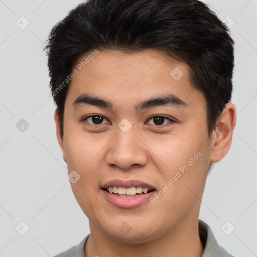 Joyful asian young-adult male with short  brown hair and brown eyes