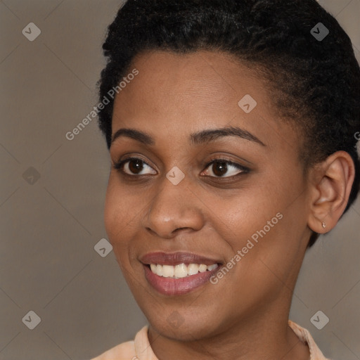 Joyful black young-adult female with short  brown hair and brown eyes