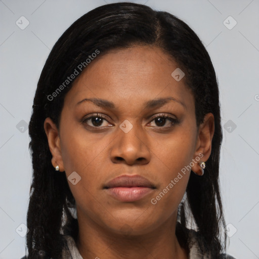 Joyful black young-adult female with long  brown hair and brown eyes