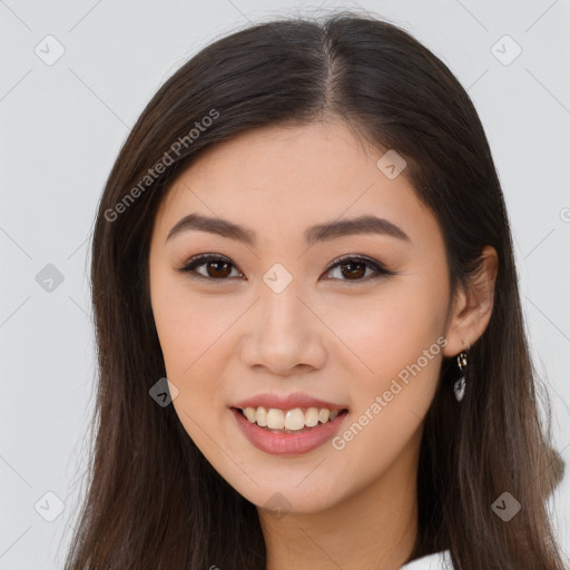 Joyful asian young-adult female with long  brown hair and brown eyes