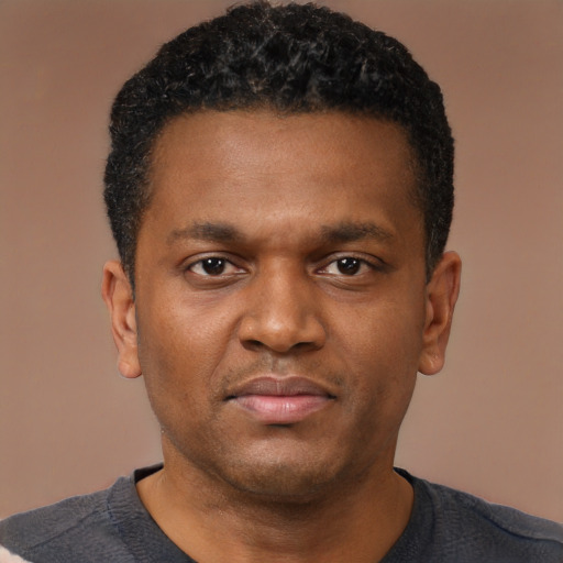 Neutral black young-adult male with short  brown hair and brown eyes