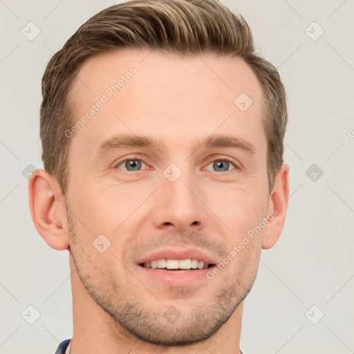 Joyful white young-adult male with short  brown hair and grey eyes