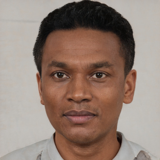 Neutral black young-adult male with short  black hair and brown eyes