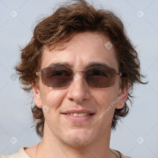 Joyful white young-adult male with medium  brown hair and brown eyes