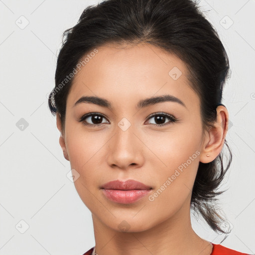 Joyful latino young-adult female with medium  brown hair and brown eyes