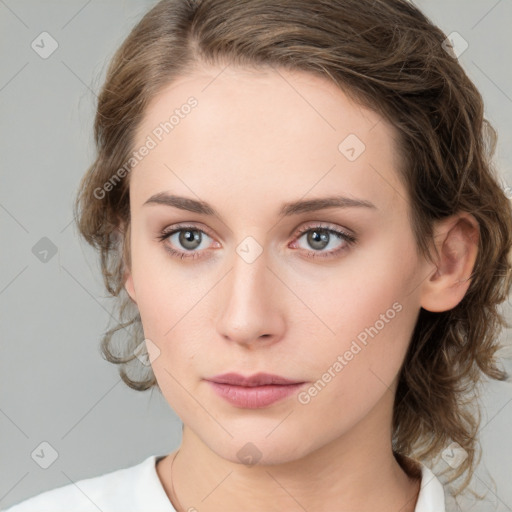 Neutral white young-adult female with medium  brown hair and green eyes