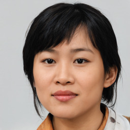 Joyful asian young-adult female with medium  black hair and brown eyes