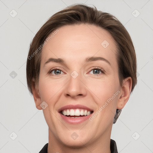 Joyful white young-adult female with short  brown hair and grey eyes