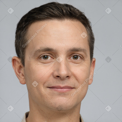 Joyful white adult male with short  brown hair and brown eyes