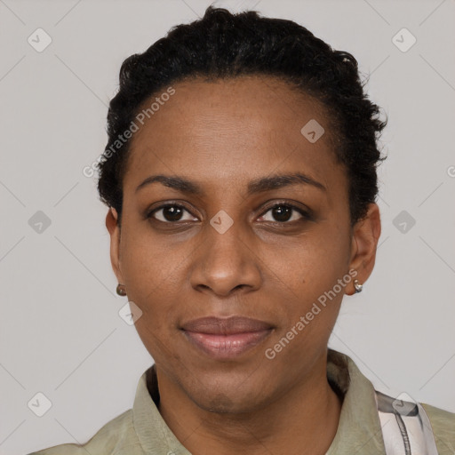 Joyful latino young-adult female with short  black hair and brown eyes