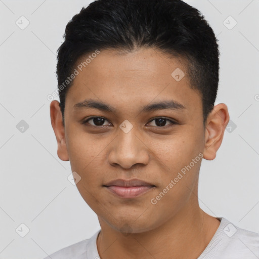 Joyful latino young-adult male with short  black hair and brown eyes