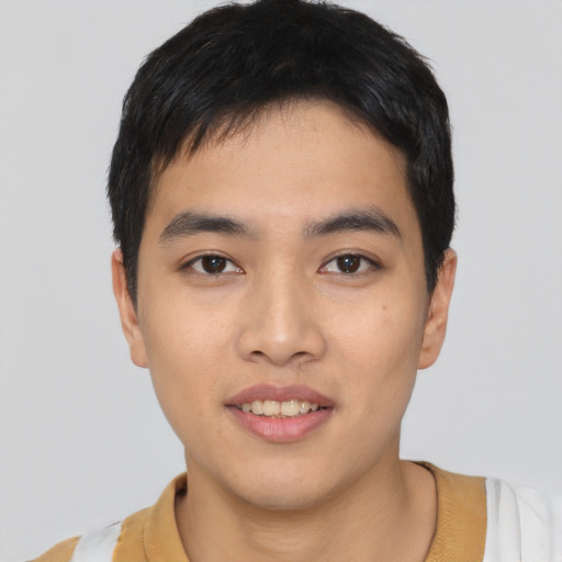 Joyful asian young-adult male with short  black hair and brown eyes