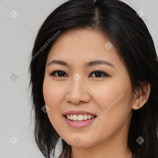 Joyful asian young-adult female with long  brown hair and brown eyes