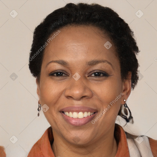 Joyful black adult female with short  brown hair and brown eyes