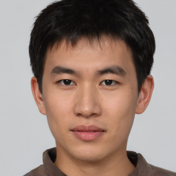 Neutral asian young-adult male with short  brown hair and brown eyes