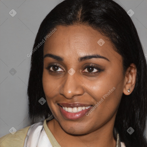 Joyful latino young-adult female with long  brown hair and brown eyes