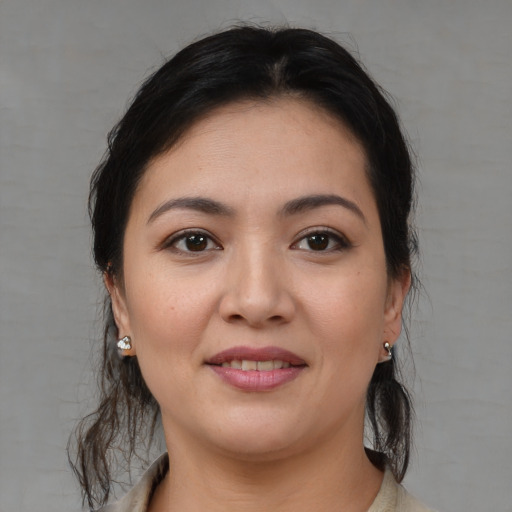 Joyful white young-adult female with medium  brown hair and brown eyes
