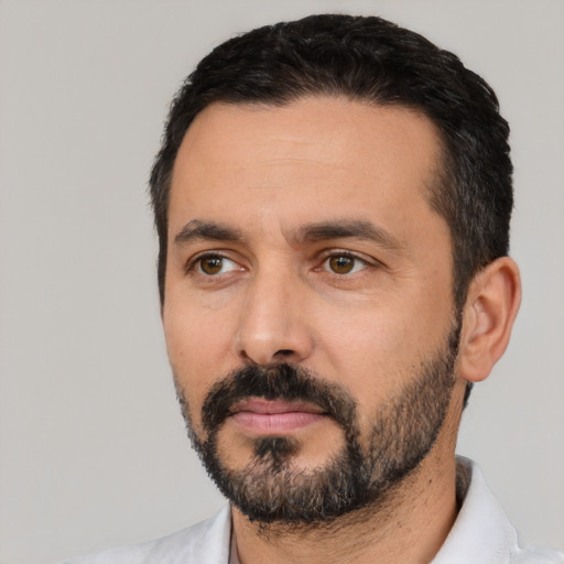 Neutral latino adult male with short  black hair and brown eyes
