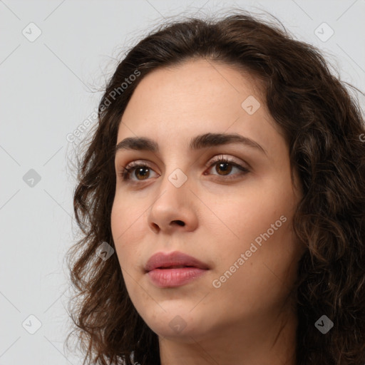 Neutral white young-adult female with long  brown hair and brown eyes