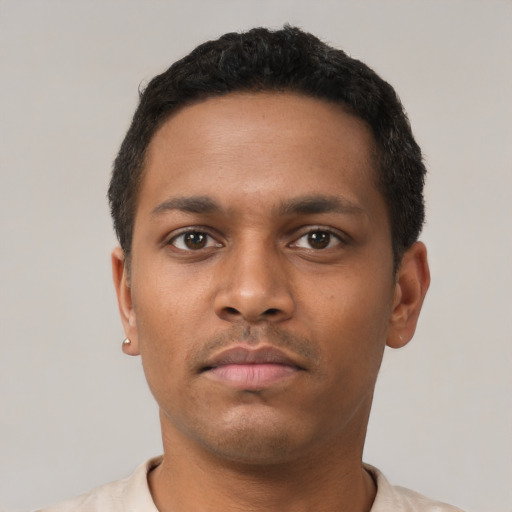 Neutral black young-adult male with short  brown hair and brown eyes