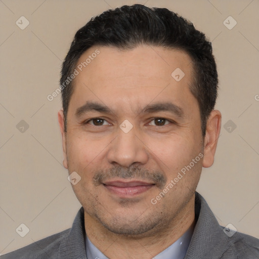 Joyful white adult male with short  black hair and brown eyes