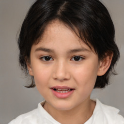 Joyful white child female with medium  brown hair and brown eyes