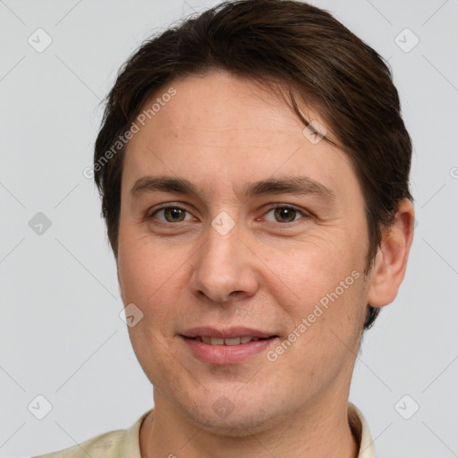 Joyful white adult male with short  brown hair and grey eyes