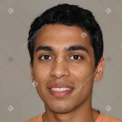 Joyful latino young-adult male with short  black hair and brown eyes