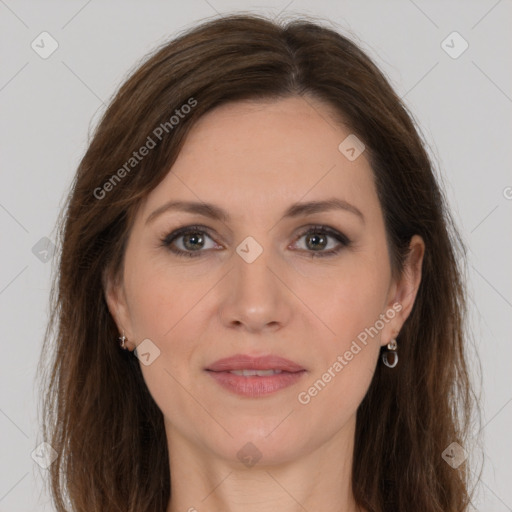 Joyful white adult female with long  brown hair and brown eyes