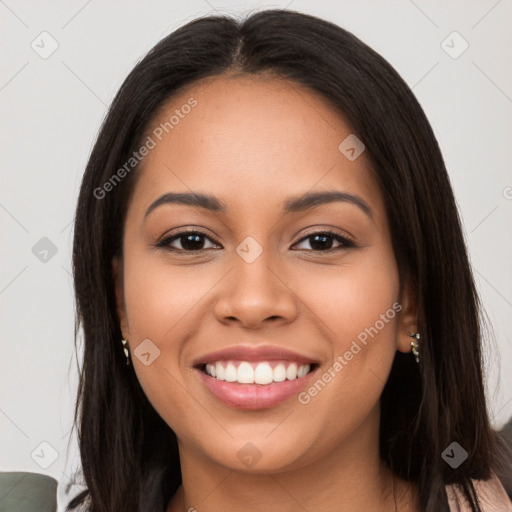 Joyful latino young-adult female with long  brown hair and brown eyes