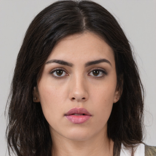Neutral white young-adult female with long  brown hair and brown eyes