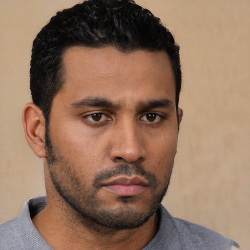 Neutral latino young-adult male with short  black hair and brown eyes