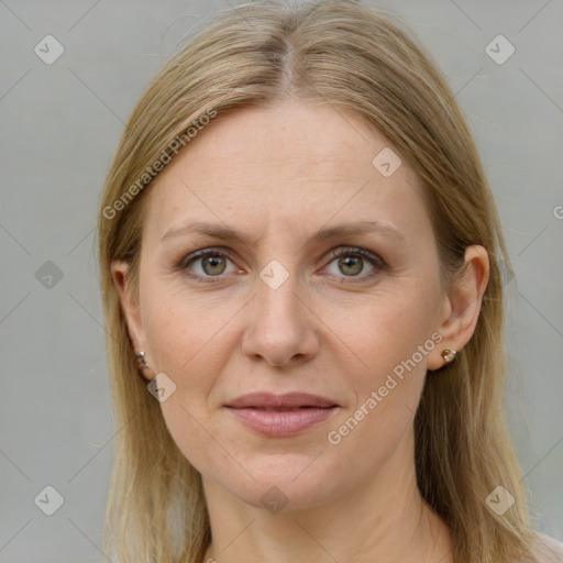 Joyful white adult female with medium  brown hair and grey eyes