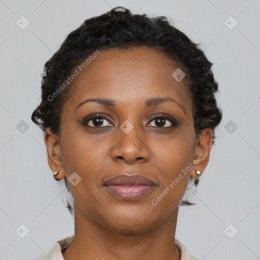 Joyful black adult female with short  brown hair and brown eyes