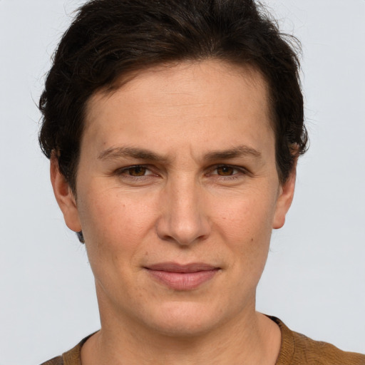 Joyful white adult female with short  brown hair and brown eyes