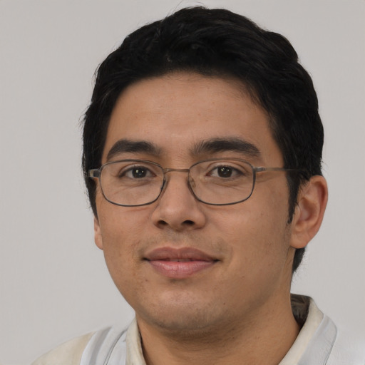 Joyful asian young-adult male with short  black hair and brown eyes