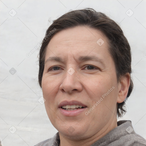 Joyful white adult female with medium  brown hair and brown eyes