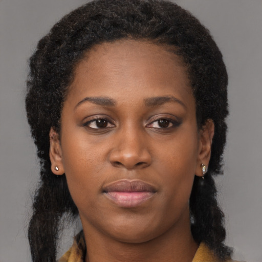 Neutral black young-adult female with long  brown hair and brown eyes