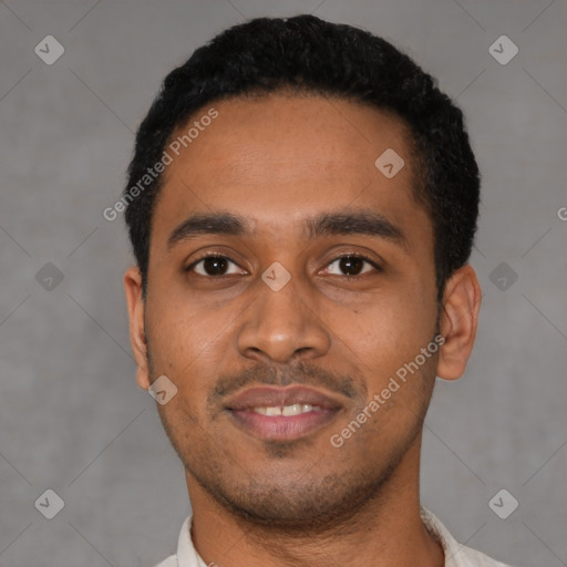 Joyful latino young-adult male with short  black hair and brown eyes