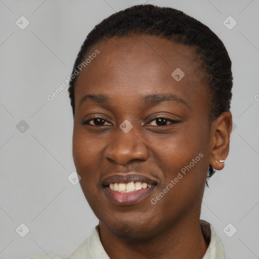 Joyful black young-adult female with short  black hair and brown eyes