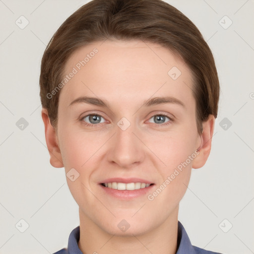 Joyful white young-adult female with short  brown hair and grey eyes