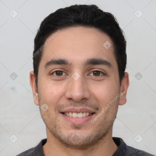 Joyful white young-adult male with short  black hair and brown eyes