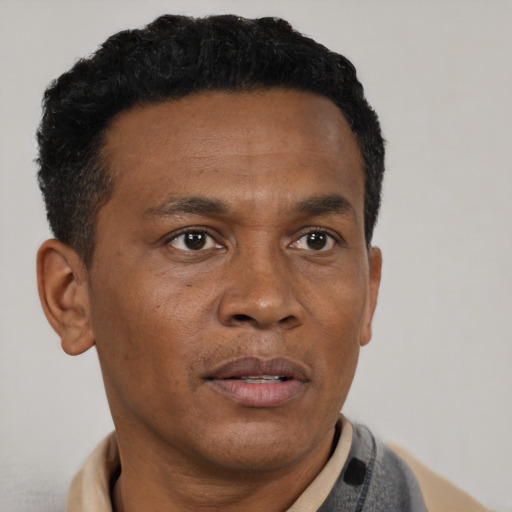 Neutral black adult male with short  black hair and brown eyes