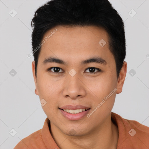 Joyful asian young-adult male with short  black hair and brown eyes