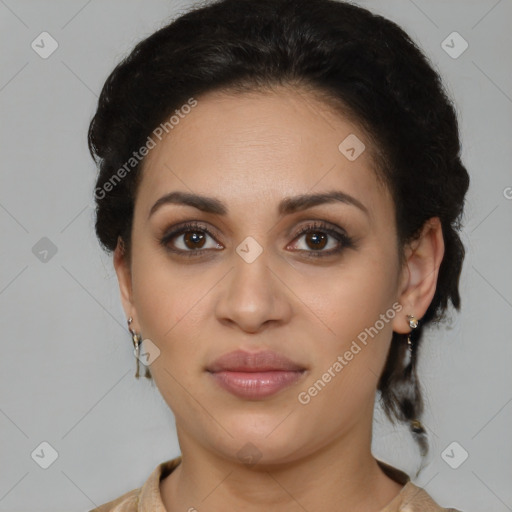 Joyful latino young-adult female with medium  brown hair and brown eyes