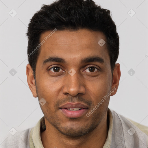 Joyful black young-adult male with short  black hair and brown eyes