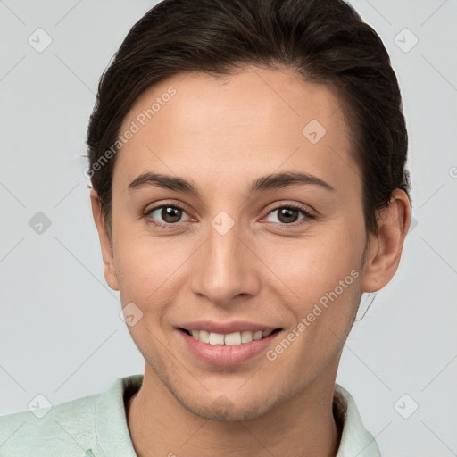 Joyful white young-adult female with short  brown hair and brown eyes