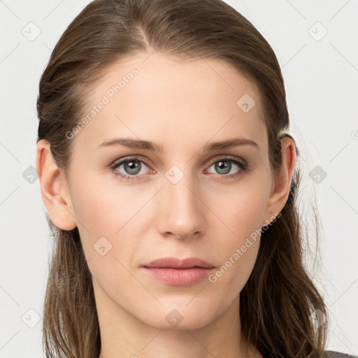 Joyful white young-adult female with long  brown hair and blue eyes