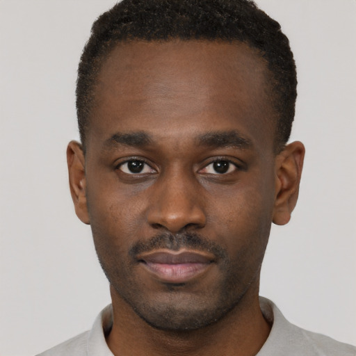 Neutral black young-adult male with short  brown hair and brown eyes